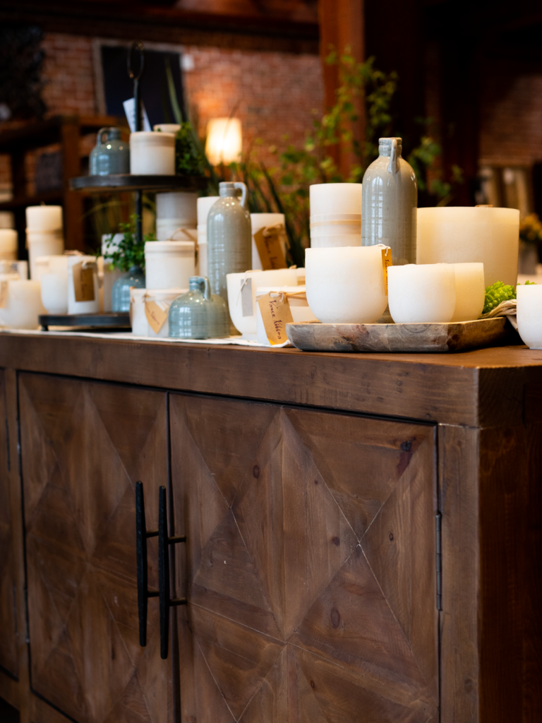 layers of vessels and candles on a beautiful sideboard