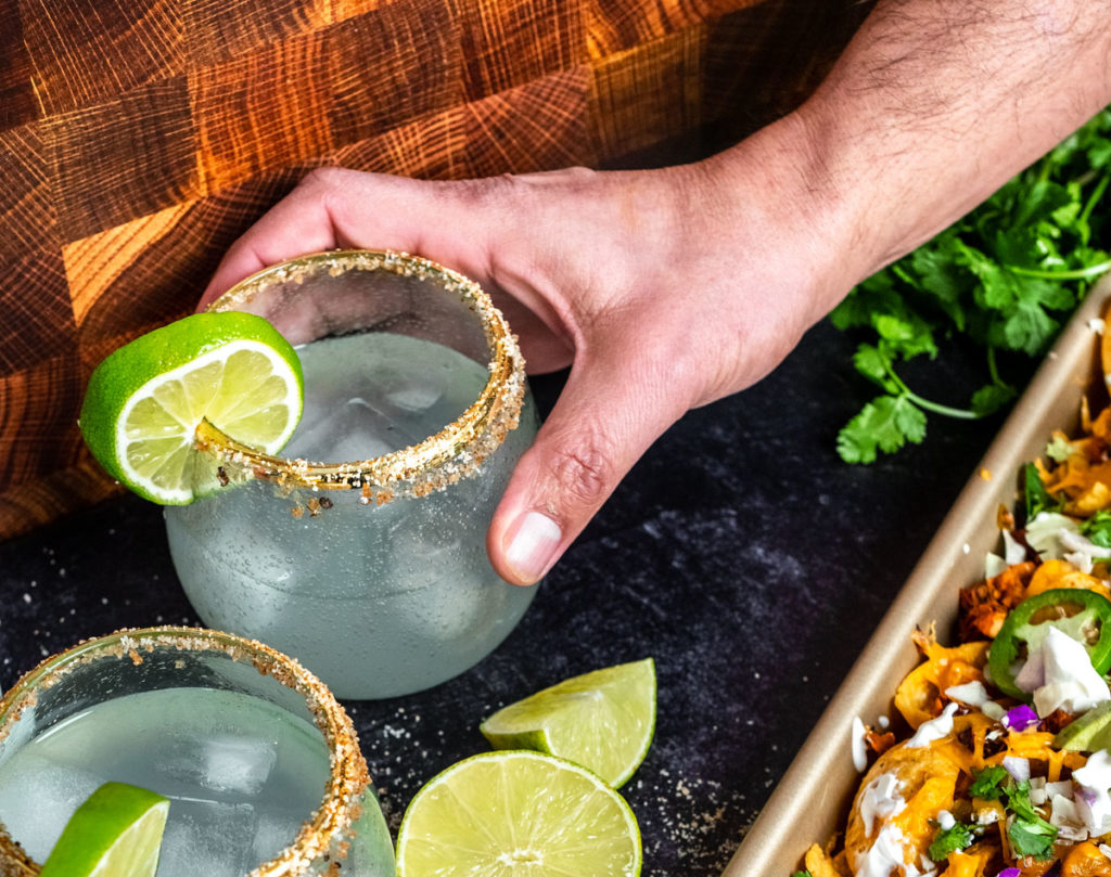 Spicy light margarita is the best pairing to balance the delicious flavors of the Chicken Chipotle Nachos.